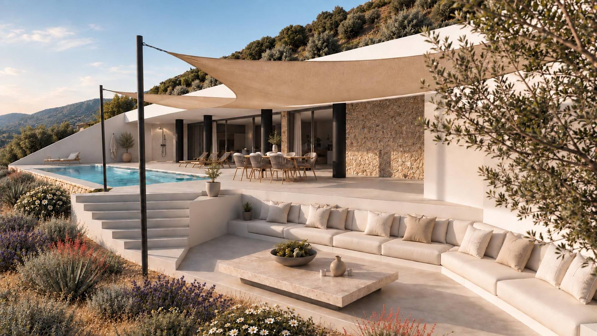 Outdoor lounge under a sunshade sail beside the pool